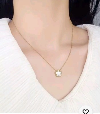 White 5 Leaf Clover Pendant On A Gold Plated Necklace